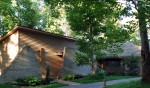Exterior of custom designed home by Pavelchak Architecture in Valle Crucis, North Carolina, near Boone that showcases exposed cast in place concrete.