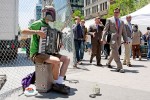 A businessman gives a puzzled look at Nathan Stodola as he plays what he calls the ‘Renegade Accordian’ in Union Square on June 1, 2009.