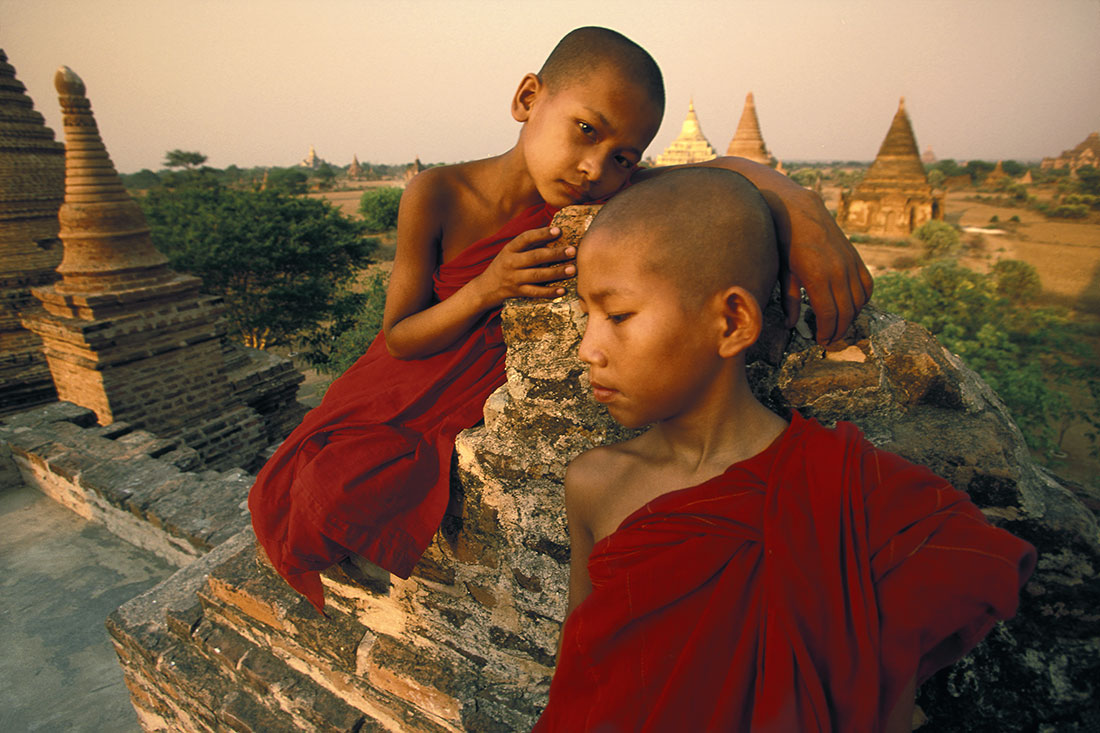 Young monks at sunset