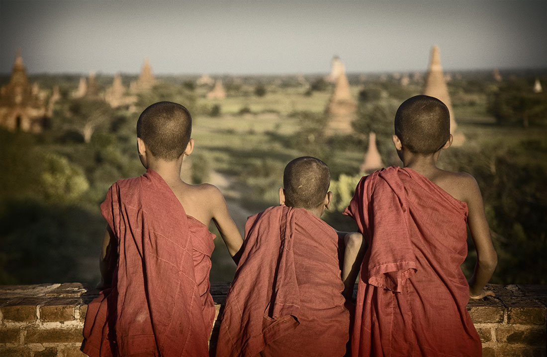         Young monks at sunset