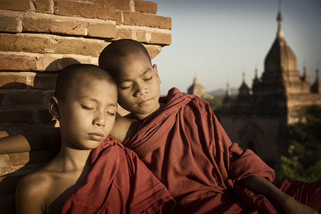        Young monks at sunset