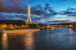 The Eiffel Tower and Seine River after dark