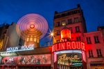 Moulin Rouge in Paris at dusk