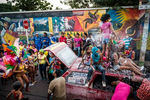 The carnival's parade stops in front of a mural depicting the story of Vallenato music in Villanueva. . While normally featuring typical carnival music and dance, here in Villanueva vallenato music and lifestyle is a big part of scene and gives a different flavor to the Carnival parties.