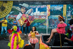 The carnival's parade stops in front of a mural depicting the story of Vallenato music in Villanueva. . While normally featuring typical carnival music and dance, here in Villanueva vallenato music and lifestyle is a big part of scene and gives a different flavor to the Carnival parties.
