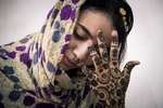 Tindouf's Saharawi refugee camps. Gabla doing her henna tattoo before her sister's wedding.