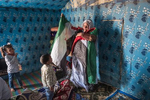 Tifariti. RASD, Saharawi administrated territories of Western Sahara. A family from the now occupied territories, had decided to come back in the RASD near Tifariti after 3 decades in the refugee camps. The matriarch showing off the flag