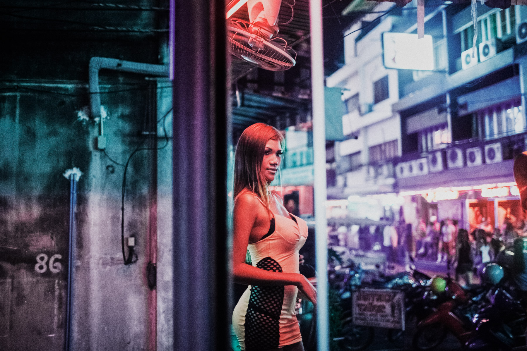 A neon-lit portrait of Yaya, a transgender prostitute in Pattaya, Thailand.