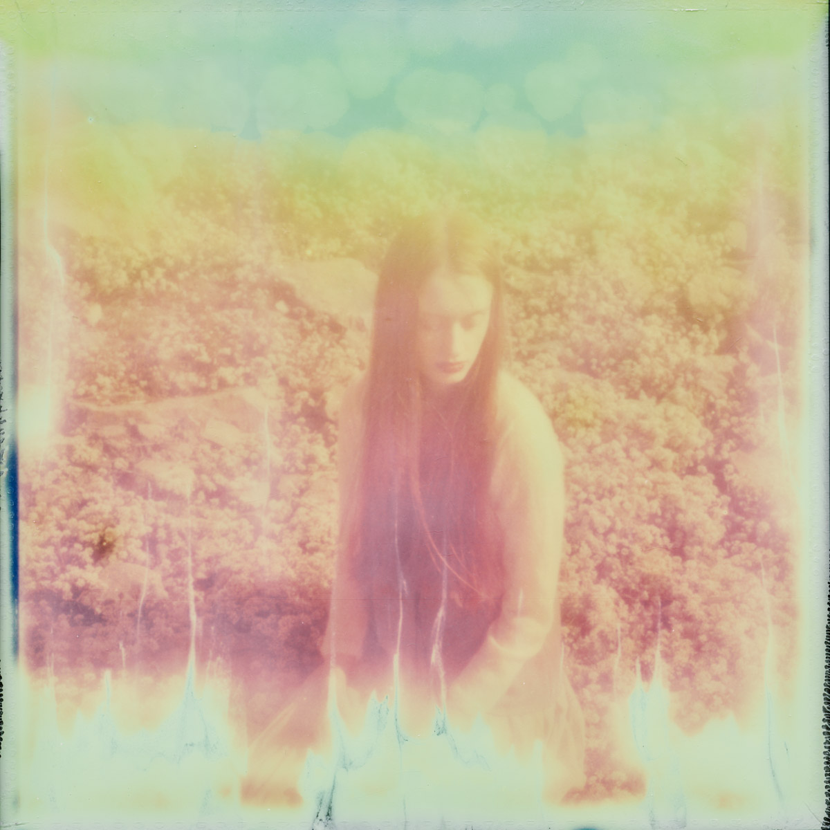 A scratched and faded Polaroid taken in the Scottish countryside with Sula Clothing.