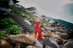 A young woman walks across rocks at the Intercontinental Sun Peninsula Resort in Danang, Vietnam.