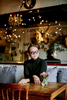 A portrait of Phoowanath Chumsrikarin, the owner of the Floral Cafe at Napasorn in Bangkok.