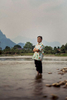 A portrait of Thanongsi Sorangkan, the owner of an organic farm and one of the accidental founders of the tubing phenomenon in Vang Vien, Laos.