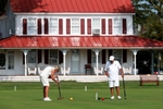 Mary McLaughlin takes a shot as Don McLaughlin looks on. Playing croquet at Green Gables Country Club, in Sea Girt.