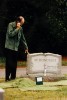 Peter says goodbye to his mother whose ashes are in the urn.