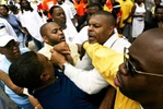 Newark Police Officer Robert Moore, a member of the mayors security detail loses control and tries to go after a booker supporter and had to be restrained my numerous people and police officers at Battle of the Brick basketball tournament in Newark.