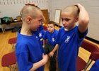 Corbin Migliaccio and Nate Porhacs check out their haircuts as students and faculty from Kennedy Elementary school shaved their head to raise money for St. Baldrick’s Foundation to help pediatric cancer research, at the school in Roxbury.