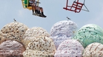 The sky ride goes over the Shake Shoppe Arcade giant scoops of ice cream on a very hot day in Seaside Heights.