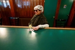 While getting her hair done at the beauty salon next door a regular customer pops in for a drink at JJ's Pub and Grill in Fair Lawn, N.J., Monday, June, 3, 2019 She does this every time she has her hair done.