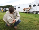 Cowboy prays before the Montgomery Rodeo hosted by Daube farms to raise money for charities, at the farm in Montgomery Township.