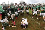 Marlboro quarterback Alex Schutzer  is surrounded by Colts Neck High School football players after his final pass play was incomplete and his team lost the game 20-14 over rival Colts Neck.