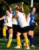 Angie Goff and Kristen Zollo celebrate Zollo's game winning score in overtime with Ali Sisco during the Metuchen High School field hockey victory over the South Brunswick High School field hockey team in the Greater Middlesex Chmapionship. South Brunswick won 3-2 in overtime.