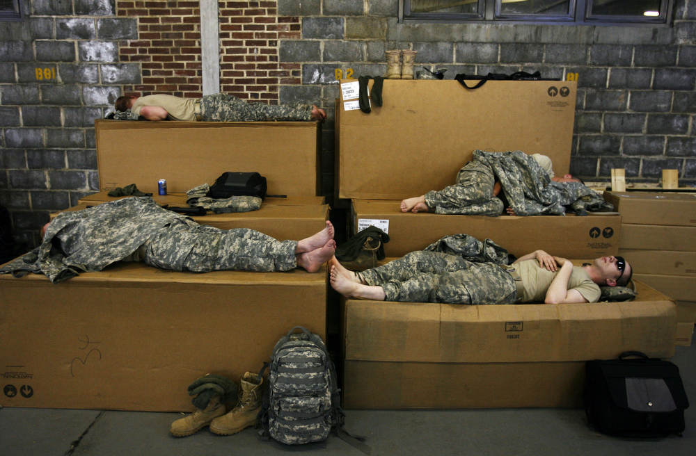 Soldiers catch some sleep around 1:45 am before the 3am wakeup at the Freehold National Guard armory in Freehold. New Jersey National Guard Bravo Company 1-114th.  