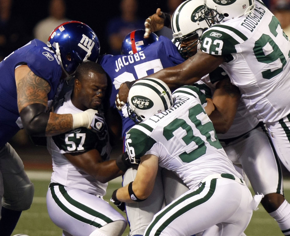 Bart Scott lost his helmet but ended up with the ball after casuing a fumlbe during the Jets versus Giants National Football Leauge game in East Rutherford. 
