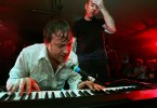 Kevin  Whelan plays the keyboard as Charles Bissel  wipes the sweat from his brow at the end of the show.