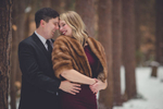 groom hugs bride during engagement portrait photography session at Erie County Forest near Buffalo, NY