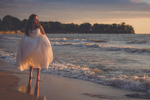 wedding photography of bride walking down beach at Camp Pioneer on Lake Erie at sunset