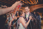 bride and grooms family throws ribbons on them during first dance at their pearl st grill and brewery wedding