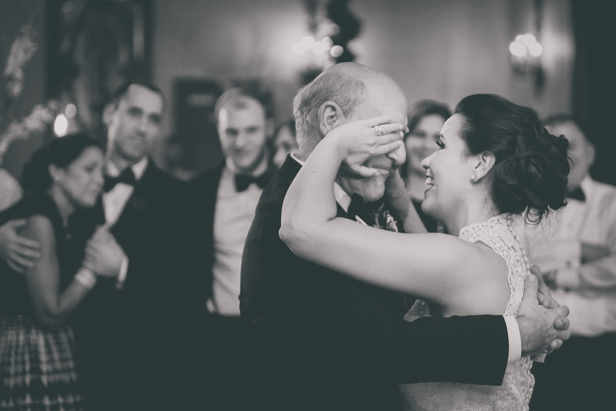 bride wipes tears from father's face during dance in Terrace Room at Statler City wedding reception in Buffalo, NY