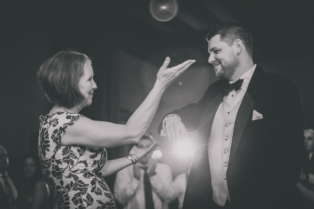 groom and mother dance in terrace room ballrom during Statler City wedding reception in Buffalo, NY