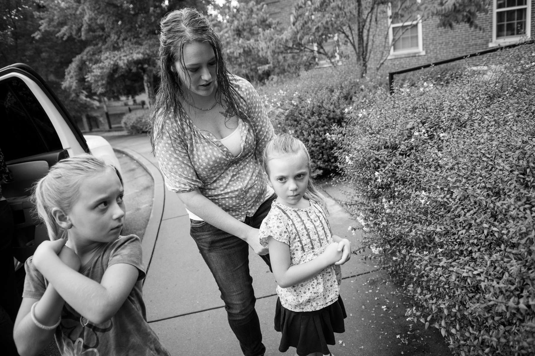Katrina Gilbert, with daughters Brooklynn, 7-years-old, and Lydia, 5-years-old, arrive at the Chambliss Center for Children to pick up son Trent, 3-years-old on August 21, 2013 in Chattanooga, TN.