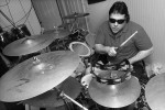 Marcus Padula, drummer for Deep Blue dJinn, lost his sight in an industrial accident when he was in his 20's. After the accident, Padula took up the drums. Today, Padula performs with the band in the Metrowest Boston area.