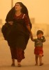 Kamal is caught in a sandstorm with her son. 