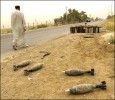 Shell casing and bomb shells litter the side of Al-Canat Rd. in southern Baghdad in front of a former Iraqi military base.  