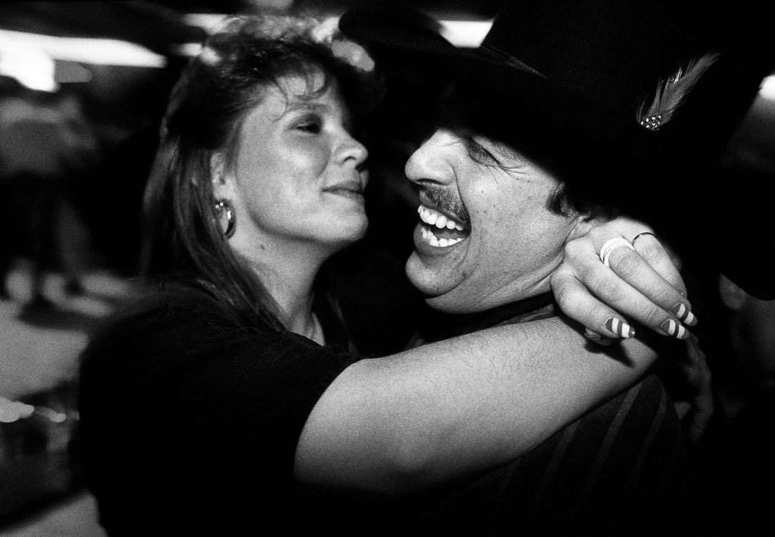 Colorado Springs bounty hunter Joe Divido dances with his girlfriend at a country-western  bar.