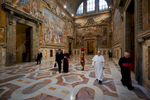 Pope Francis passes through Sala Regia  after his {quote}Urbi et Orbi{quote} address on Christmas Day.
