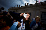 Pilgrims rejoice as Pope Francis approaches them during a general audience in Vatican City.