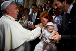 Pope Francis blesses newlyweds during a general audience.