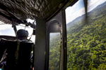 A Honduran military helicopter ferrying archeologists into the Mosquitia jungle approaches the camp landing zone.
