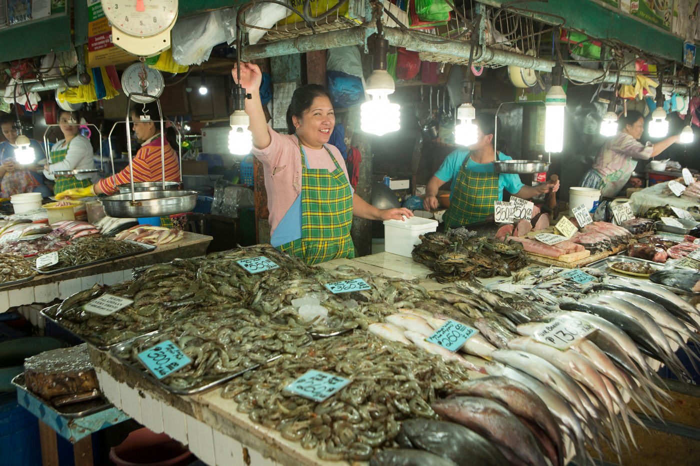 Fish mongers at the Maharlika Market in Baguio, Philippines, for The Travel Channel.