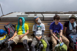 Exhausted hikers rest at a station on the Yoshida trail, Mount Fuji's most popular route.