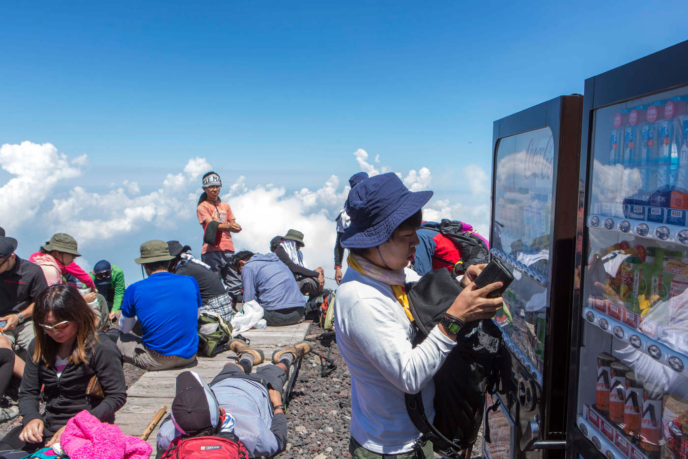 A hiker buys a cold drink from a vending machine on Mount Fuji's 13,389 ft summit. 