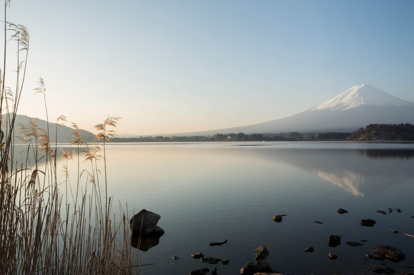 Mt. Fuji reflects in the waters of Lake Kawaguchiko.