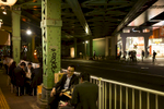 Salarymen enjoy an evening drink under the train tracks near Yurakucho Station.