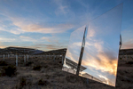 The setting sun reflects in one of Ivanpah's 174,000 mirrors.