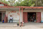 Martin De Lagarza's grocery and tire shop seats right across the wall separatig the U.S. and Mexico.