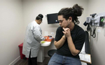 February 19, 2019 - Atlanta, GA - TK Hadman, 30, is examined by Dr. Scott Parry, DO, who oversees his general health and hormone replacement therapy. TK, who is transgender,  was assigned female at birth but struggled with that gender until he transitioned to male six years ago. ''I'm totally  at peace in my true gender,'' he said..Pictured: TK waits for nurse to take blood sample (Credit Image: © Robin Rayne/ZUMA Wire)